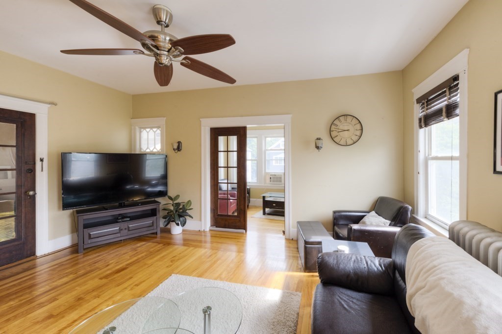 39 Woodford Street, Unit 3 Worcester, MA 01604 - Photo 11 of 37 a living room with furniture and a flat screen tv