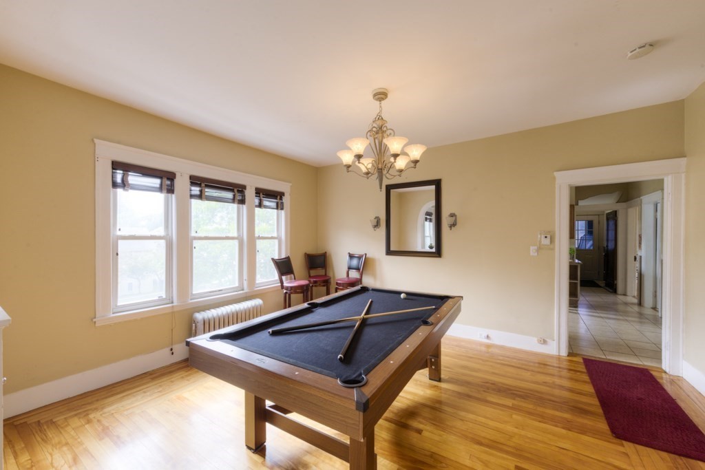 39 Woodford Street, Unit 3 Worcester, MA 01604 - Photo 12 of 37 a living room with a table chairs and a window
