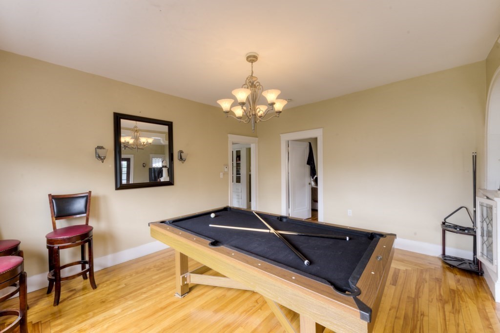 39 Woodford Street, Unit 3 Worcester, MA 01604 - Photo 13 of 37 a living room with a table chairs and a wooden floor