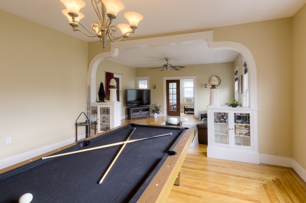 39 Woodford Street, Unit 3 Worcester, MA 01604 - Photo 14 of 37 a view of a living room and chandelier