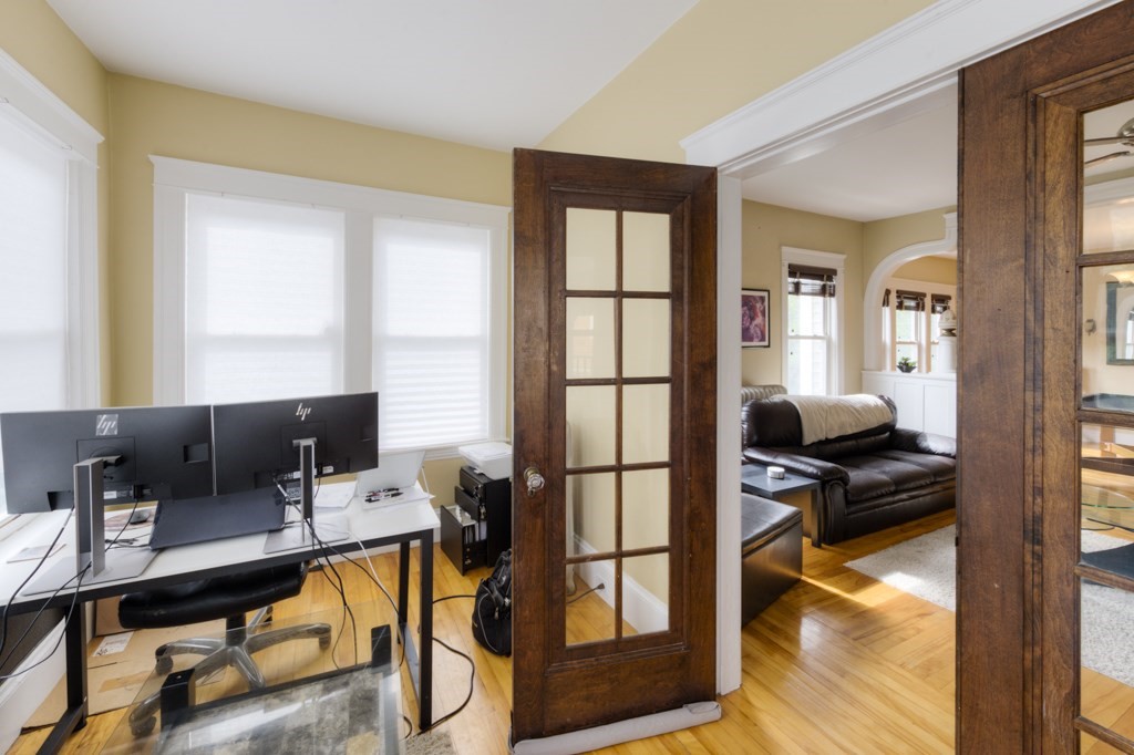 39 Woodford Street, Unit 3 Worcester, MA 01604 - Photo 17 of 37 a living room with furniture a rug and a window