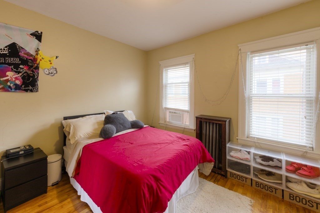 39 Woodford Street, Unit 3 Worcester, MA 01604 - Photo 19 of 37 a bed sitting in a bedroom next to a window