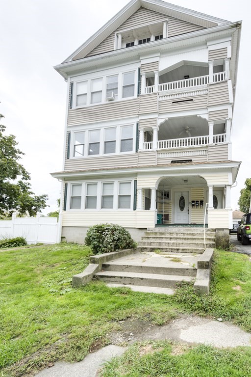 39 Woodford Street, Unit 3 Worcester, MA 01604 - Photo 2 of 37 a front view of a house with a yard