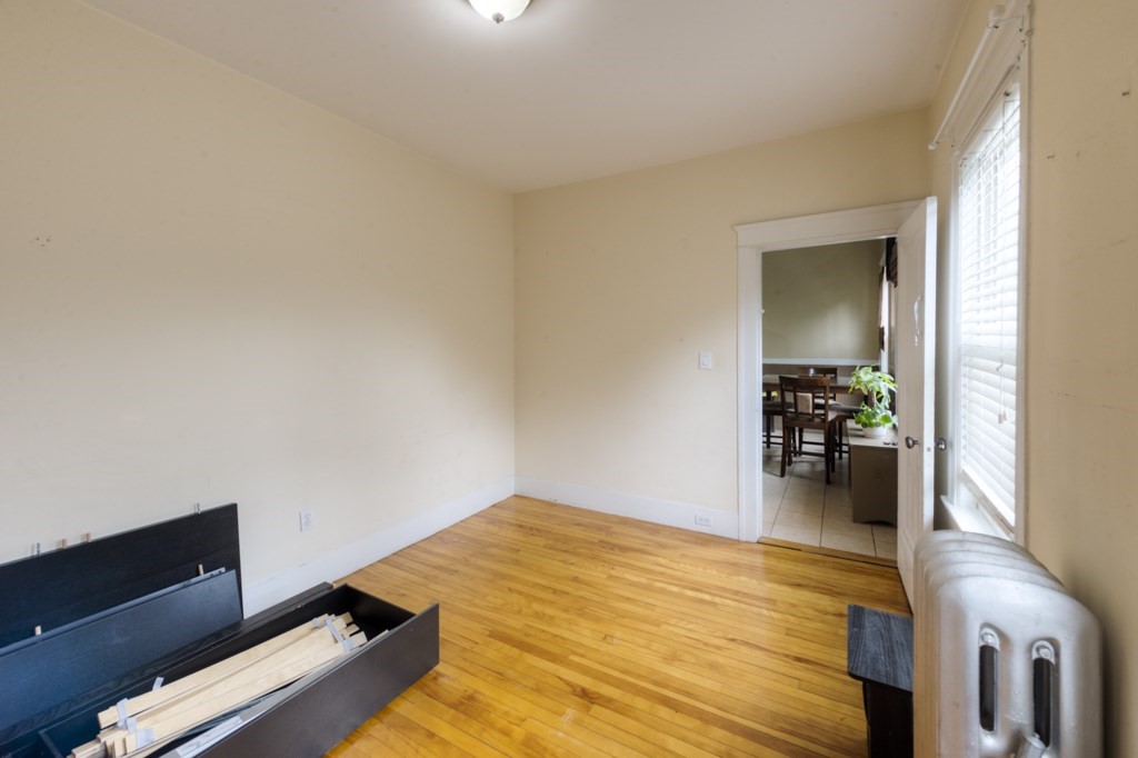 39 Woodford Street, Unit 3 Worcester, MA 01604 - Photo 31 of 37 a room with a bed and furniture