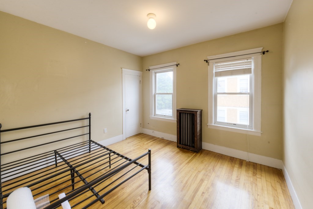39 Woodford Street, Unit 3 Worcester, MA 01604 - Photo 32 of 37 a view of a livingroom with wooden floor and a window