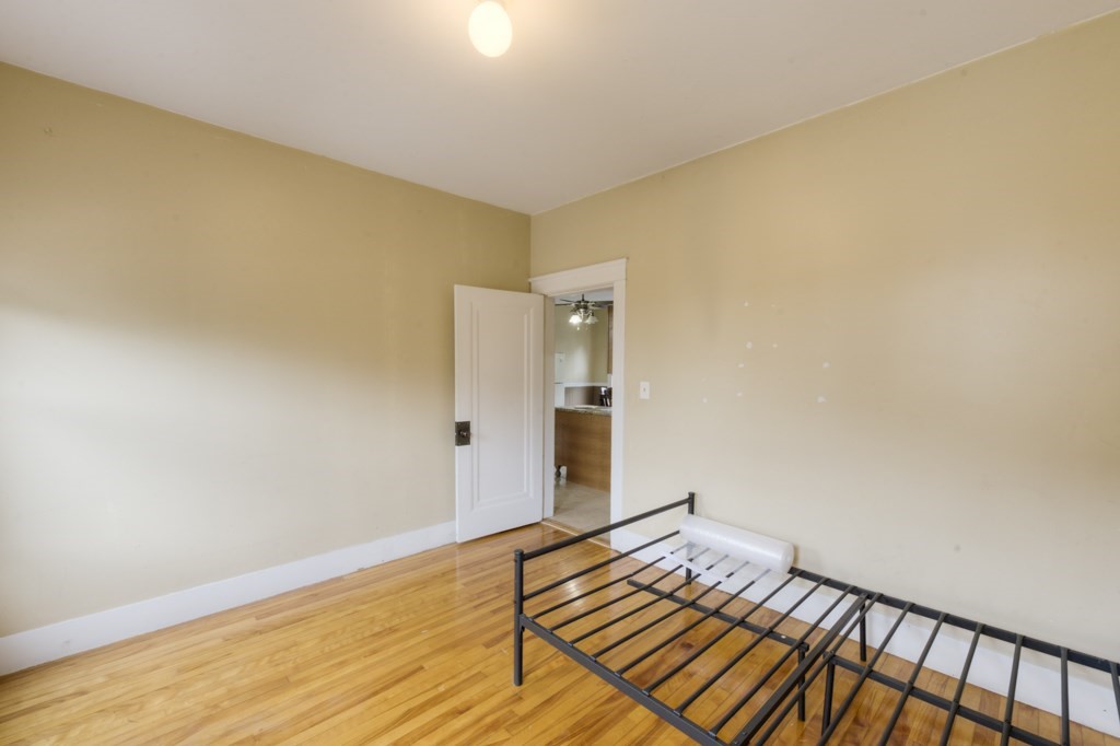 39 Woodford Street, Unit 3 Worcester, MA 01604 - Photo 34 of 37 a view of an empty room and wooden floor