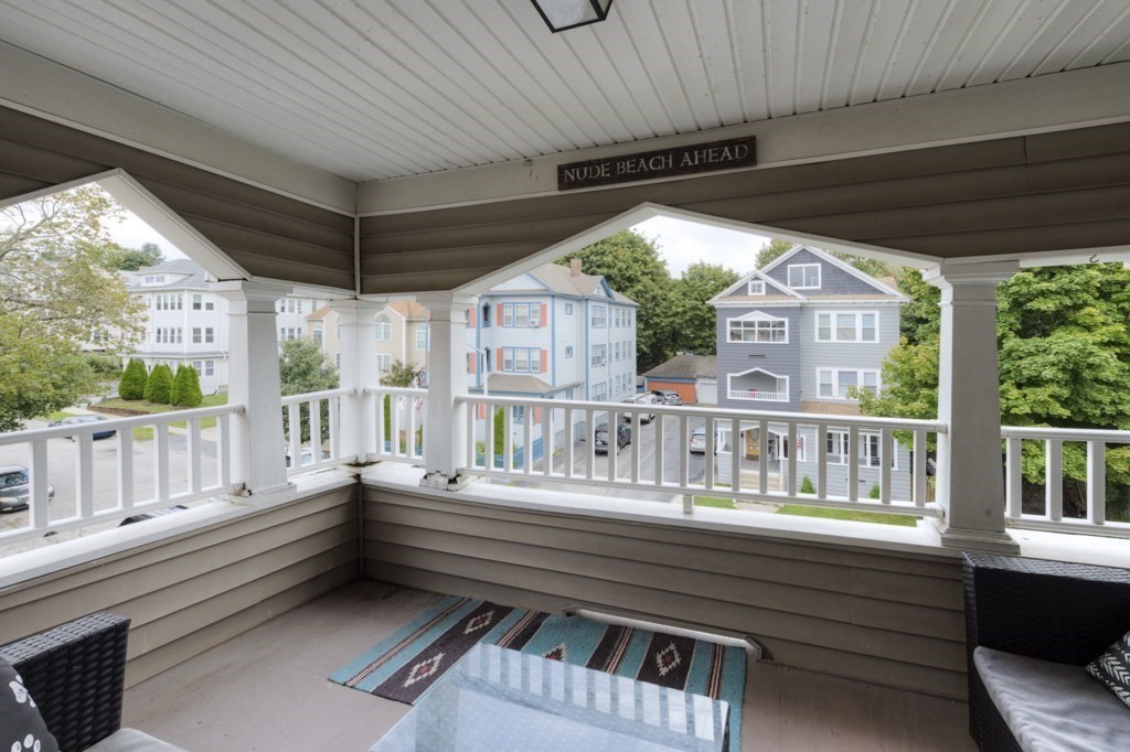 39 Woodford Street, Unit 3 Worcester, MA 01604 - Photo 4 of 37 a balcony with hardwood