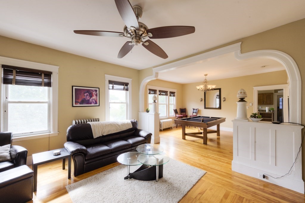 39 Woodford Street, Unit 3 Worcester, MA 01604 - Photo 8 of 37 a living room with furniture and a wooden floor