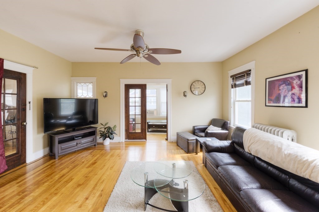 39 Woodford Street, Unit 3 Worcester, MA 01604 - Photo 10 of 37 a living room with furniture and a flat screen tv