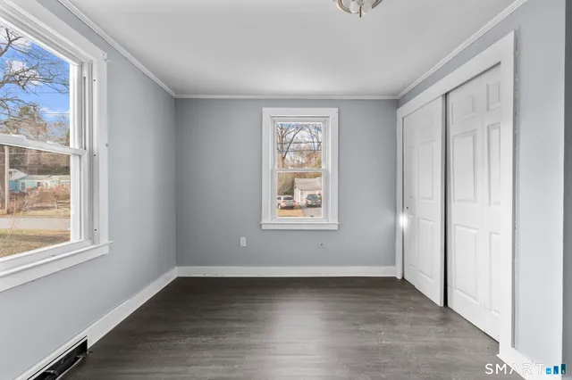 a view of an empty room with glass door