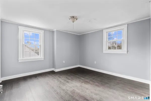 a view of a hallway with staircase