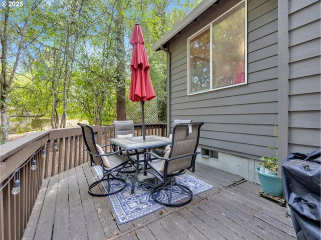 a view of a chairs and table on the deck