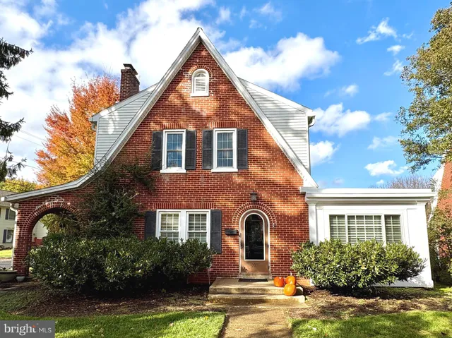 a front view of a house with yard