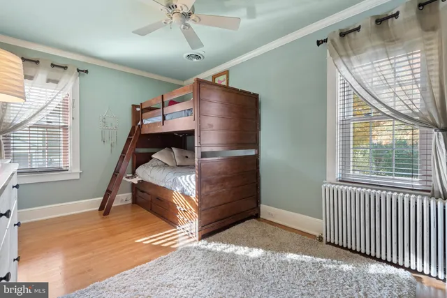 a bedroom with windows