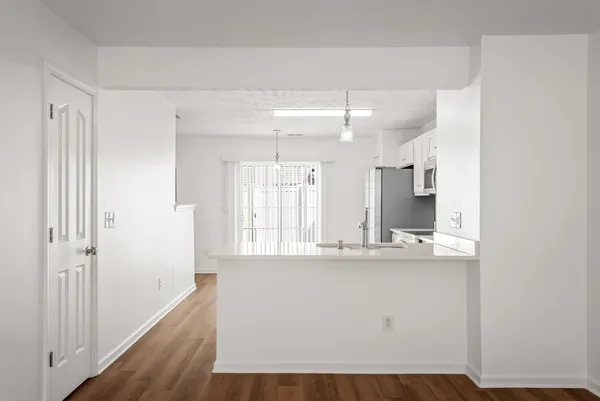 a bathroom with a sink a mirror and a light fixture