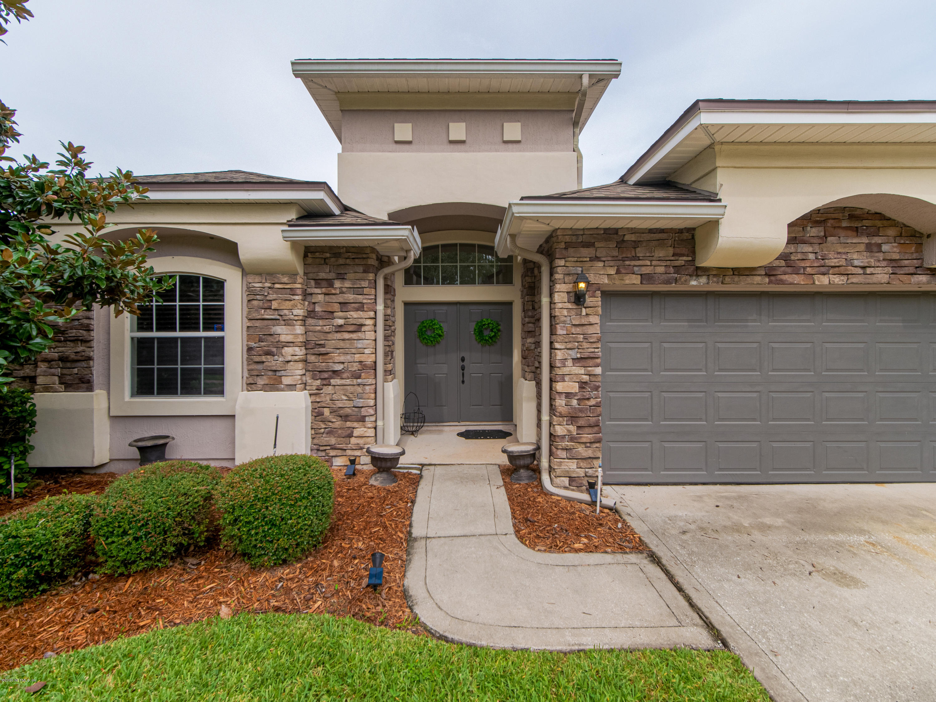 6489 Ginnie Springs Road Jacksonville, FL 32258 - Photo 6 of 38 Classy Stacked Stone on Exterior!