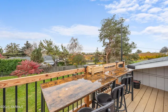 a view of a balcony with furniture