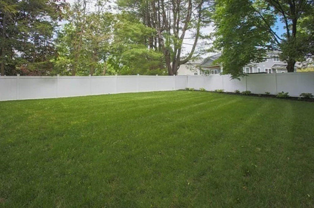 35 Hanson Road, Unit 35 Newton, MA 02459 - Photo 13 of 13 a view of yard with swimming pool and trees in the background