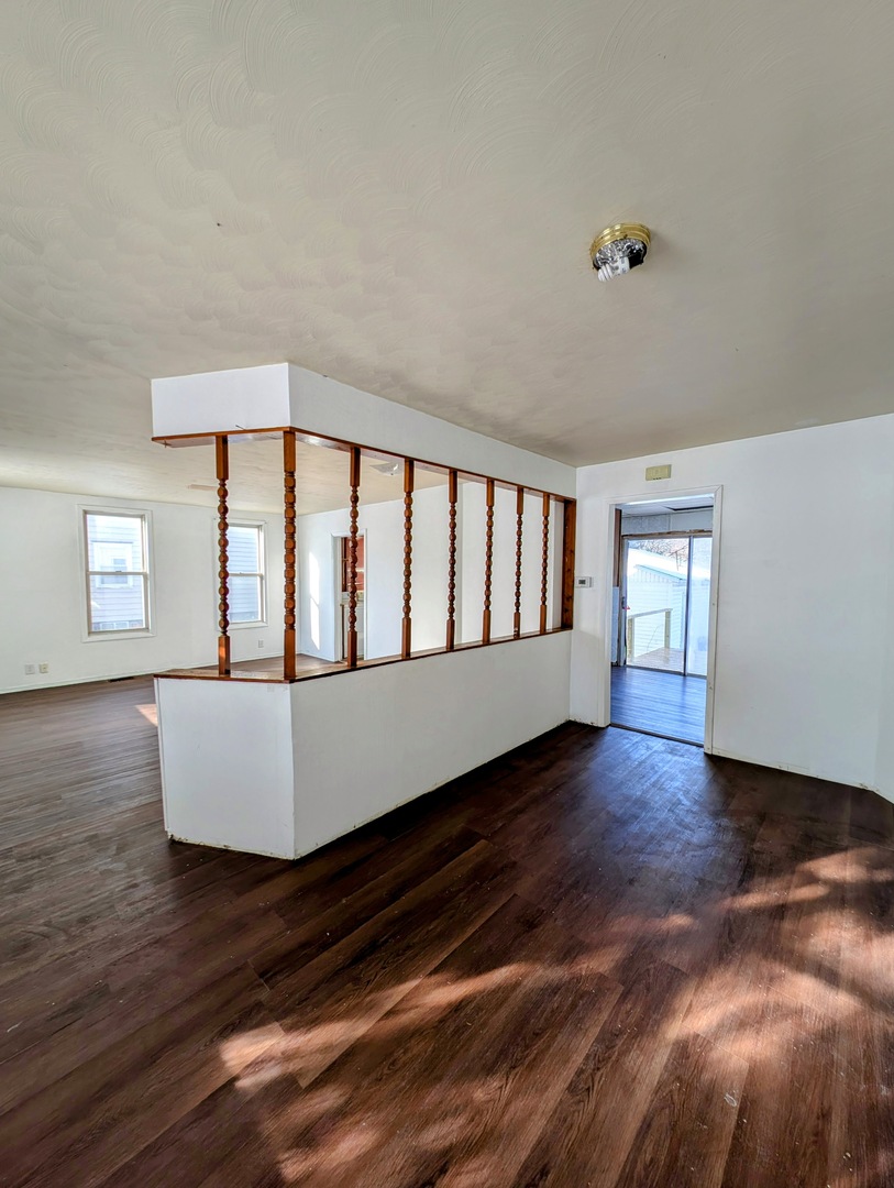 543 East 3rd Street El Paso, IL 61738 - Photo 11 of 21 a large white bed sitting in a room next to a window