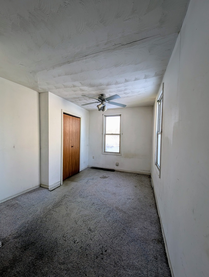 543 East 3rd Street El Paso, IL 61738 - Photo 14 of 21 an empty room with windows and cabinet