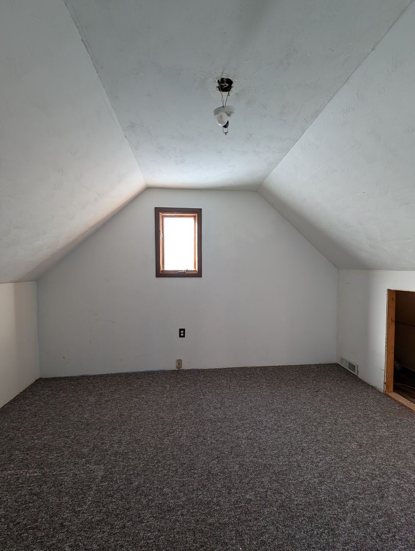 543 East 3rd Street El Paso, IL 61738 - Photo 4 of 21 an empty room with a empty space and windows