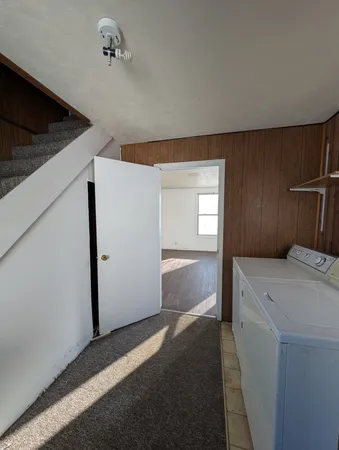 a view of storage and utility room with closet