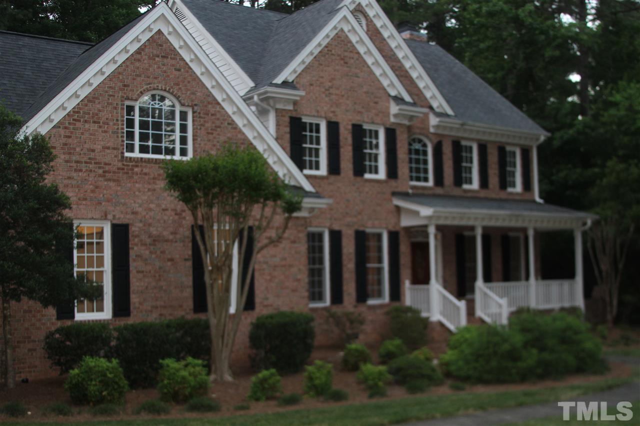 4205 White Chapel Way Raleigh, NC 27615 - Photo 1 of 8 a front view of a house with a yard and plants