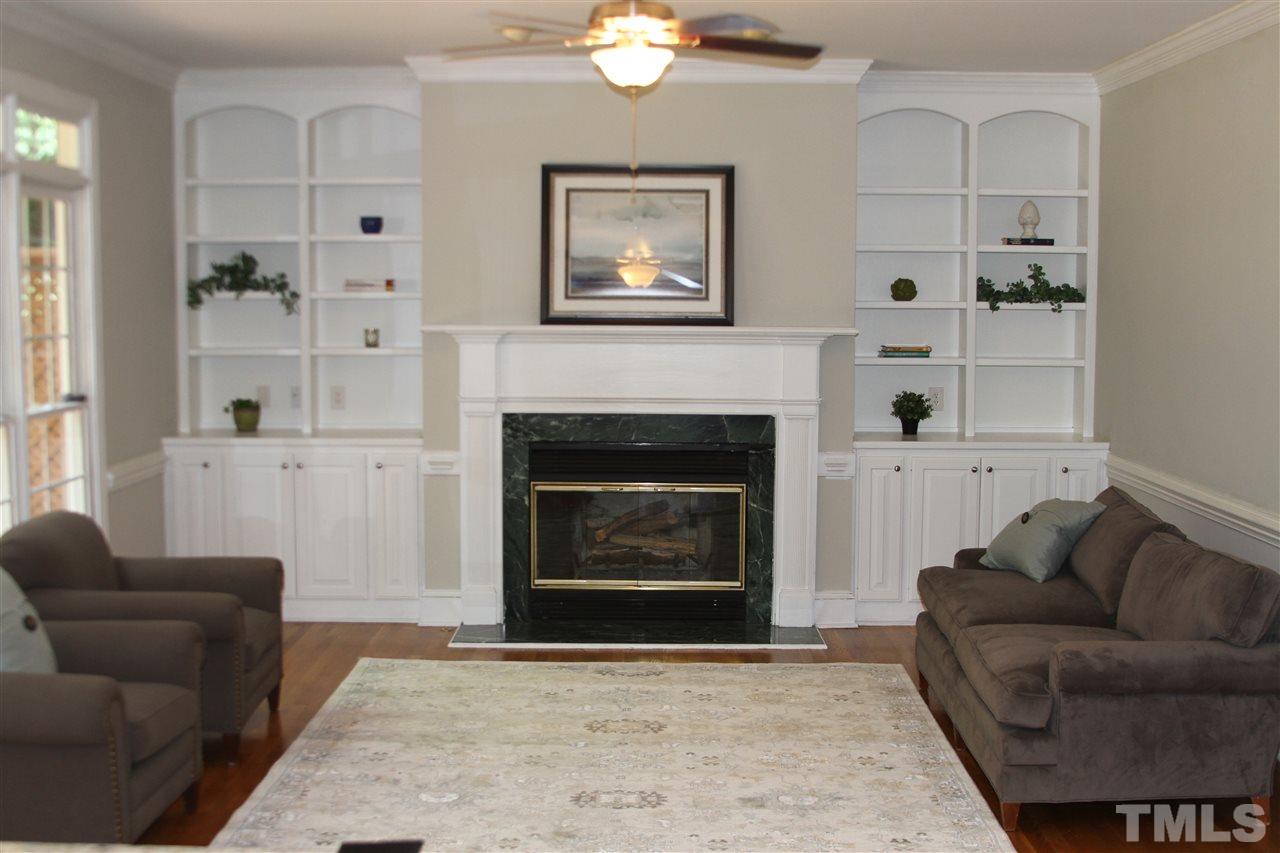 4205 White Chapel Way Raleigh, NC 27615 - Photo 3 of 8 a living room with furniture and a fireplace
