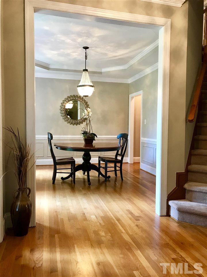 4205 White Chapel Way Raleigh, NC 27615 - Photo 4 of 8 a dining room with furniture and wooden floor