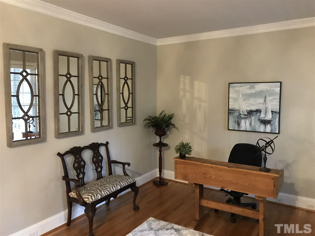 4205 White Chapel Way Raleigh, NC 27615 - Photo 7 of 8 a living room with furniture and wooden floor