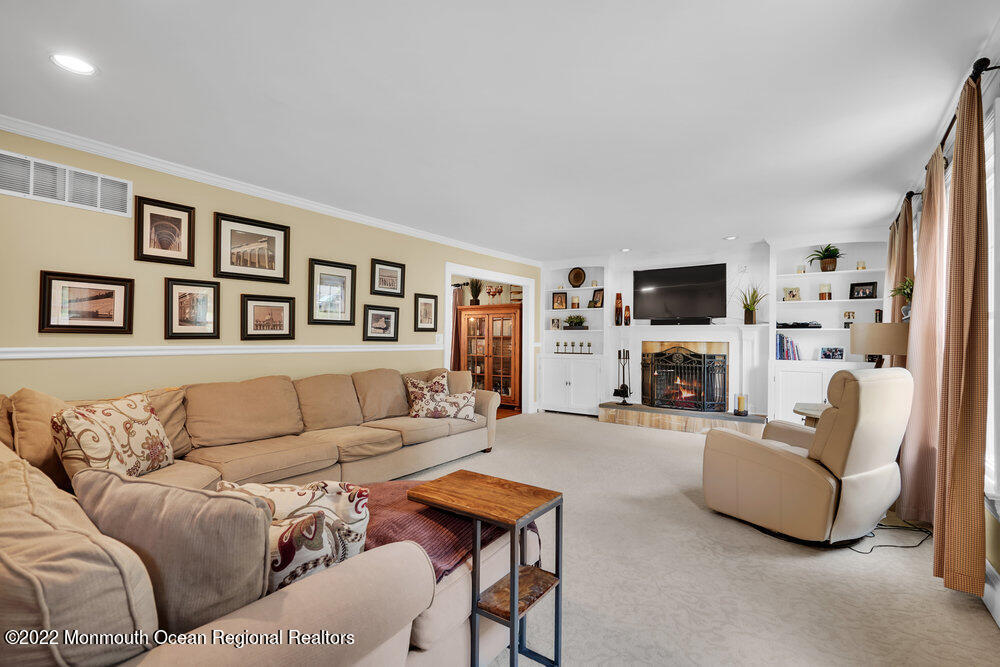 1722 Burrsville Road Brick, NJ 08724 - Photo 14 of 71 a living room with furniture and a flat screen tv