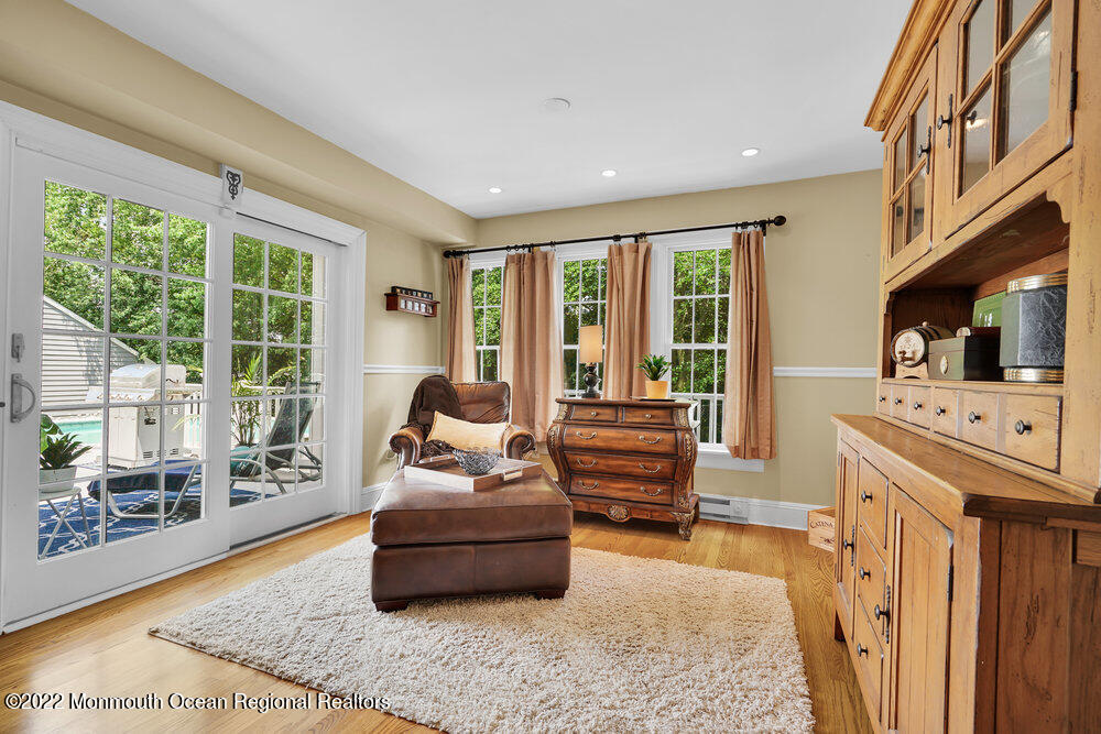 1722 Burrsville Road Brick, NJ 08724 - Photo 23 of 71 a living room with furniture and a flat screen tv