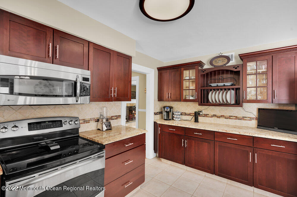 1722 Burrsville Road Brick, NJ 08724 - Photo 29 of 71 a kitchen with a sink stove and microwave