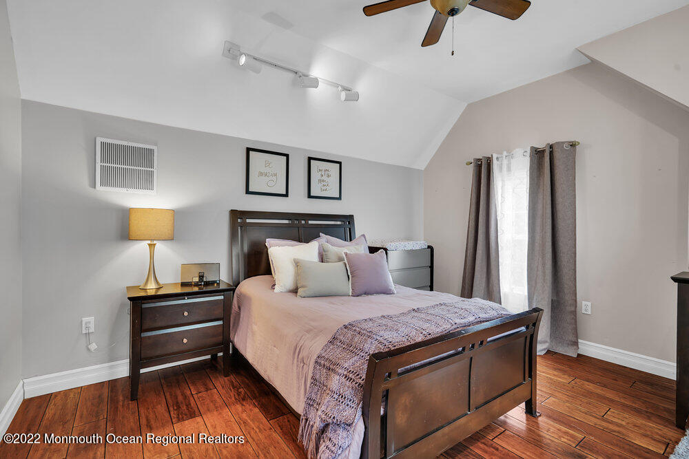 1722 Burrsville Road Brick, NJ 08724 - Photo 42 of 71 a bedroom with a bed and wooden floor