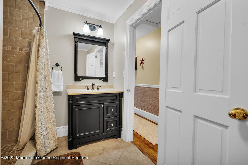 1722 Burrsville Road Brick, NJ 08724 - Photo 49 of 71 a bathroom with a sink and a mirror