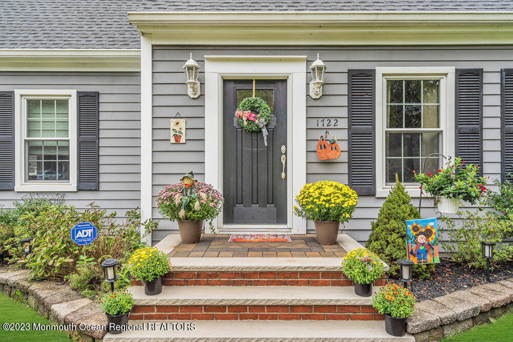 1722 Burrsville Road Brick, NJ 08724 - Photo 5 of 71 a front view of a house with potted plants