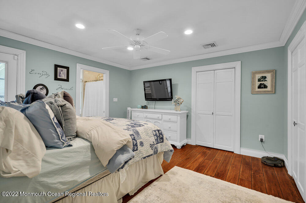 1722 Burrsville Road Brick, NJ 08724 - Photo 51 of 71 a bedroom with a bed and a flat screen tv