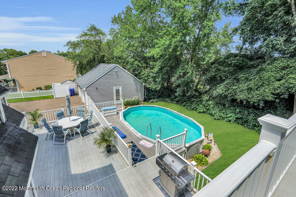 1722 Burrsville Road Brick, NJ 08724 - Photo 59 of 71 an aerial view of a house with a swimming pool patio and outdoor seating