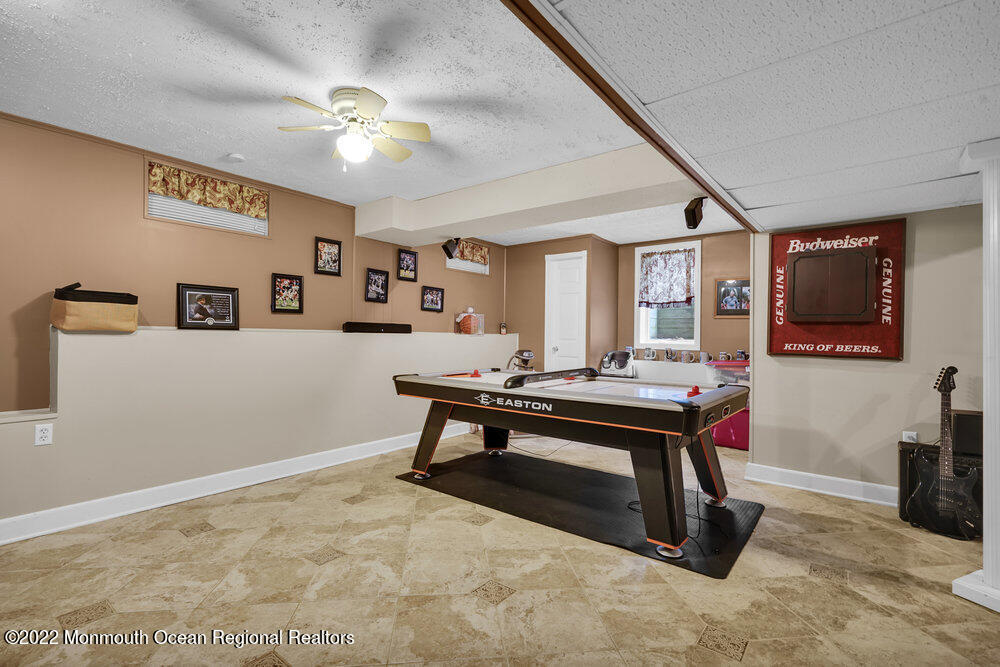 1722 Burrsville Road Brick, NJ 08724 - Photo 62 of 71 a view of a livingroom with furniture and a flat screen tv