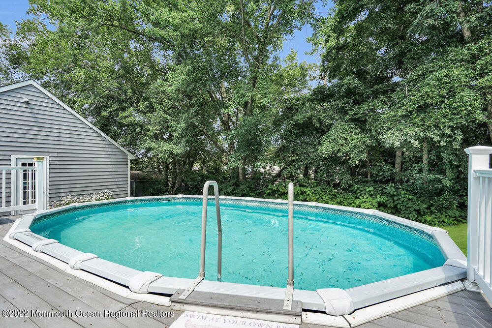 1722 Burrsville Road Brick, NJ 08724 - Photo 70 of 71 a view of a backyard with a small cabin