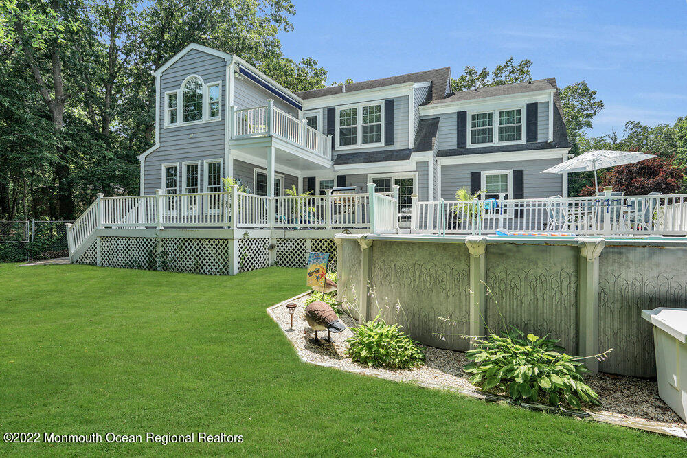 1722 Burrsville Road Brick, NJ 08724 - Photo 9 of 71 a front view of a house with a yard table and chairs