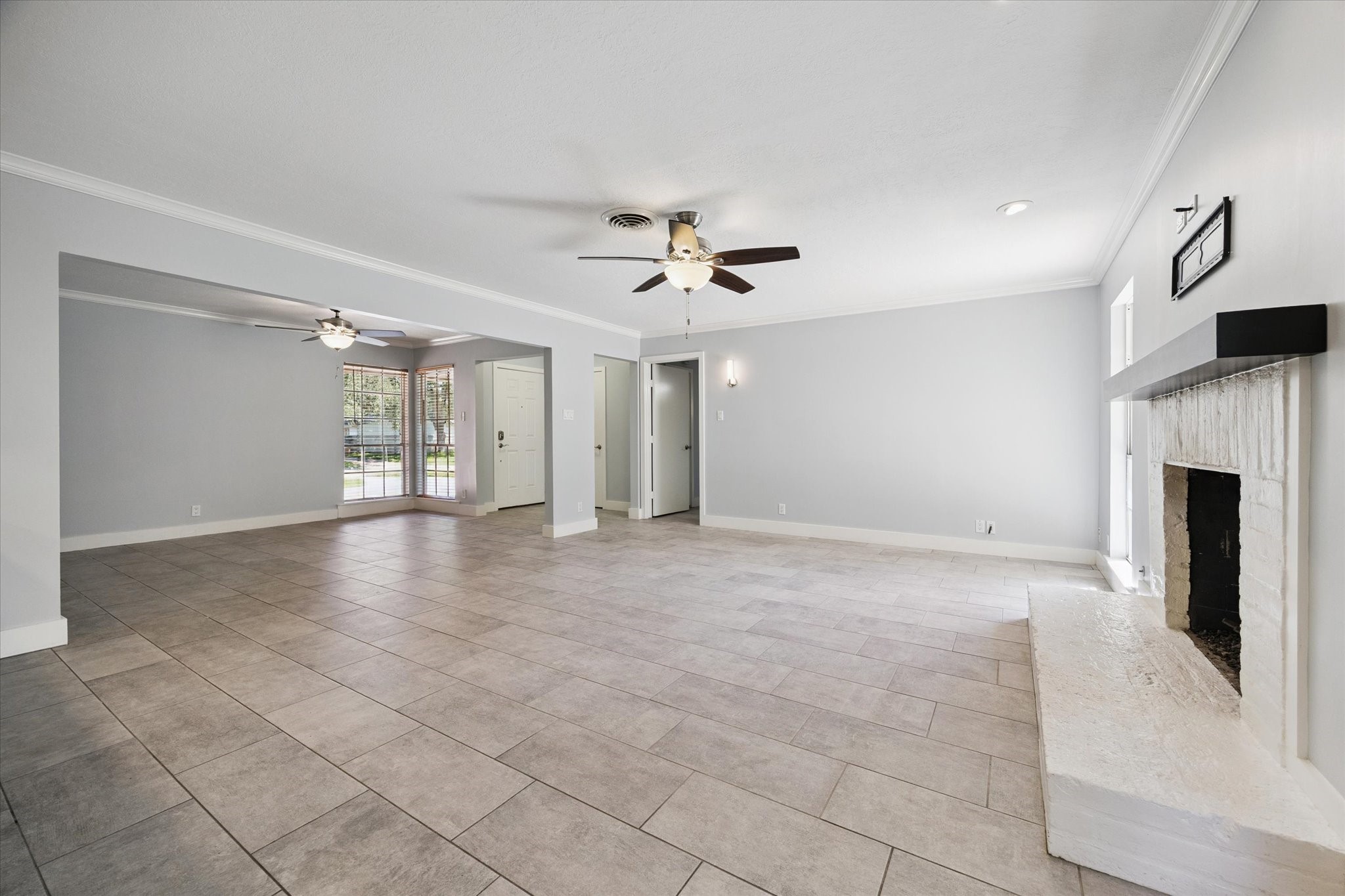 9407 Meadowbriar Lane Houston, TX 77063 - Photo 14 of 31 a view of an empty room with a fireplace