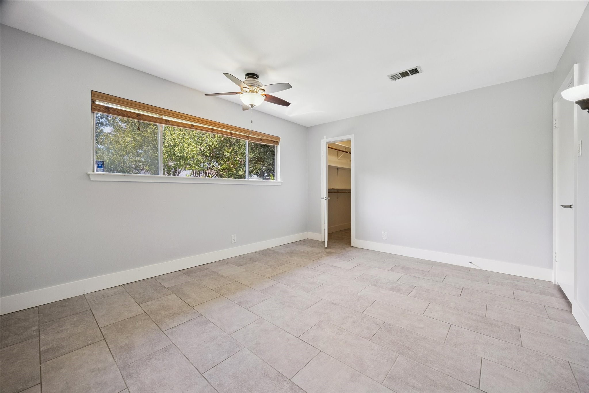 9407 Meadowbriar Lane Houston, TX 77063 - Photo 24 of 31 a view of an empty room with a window