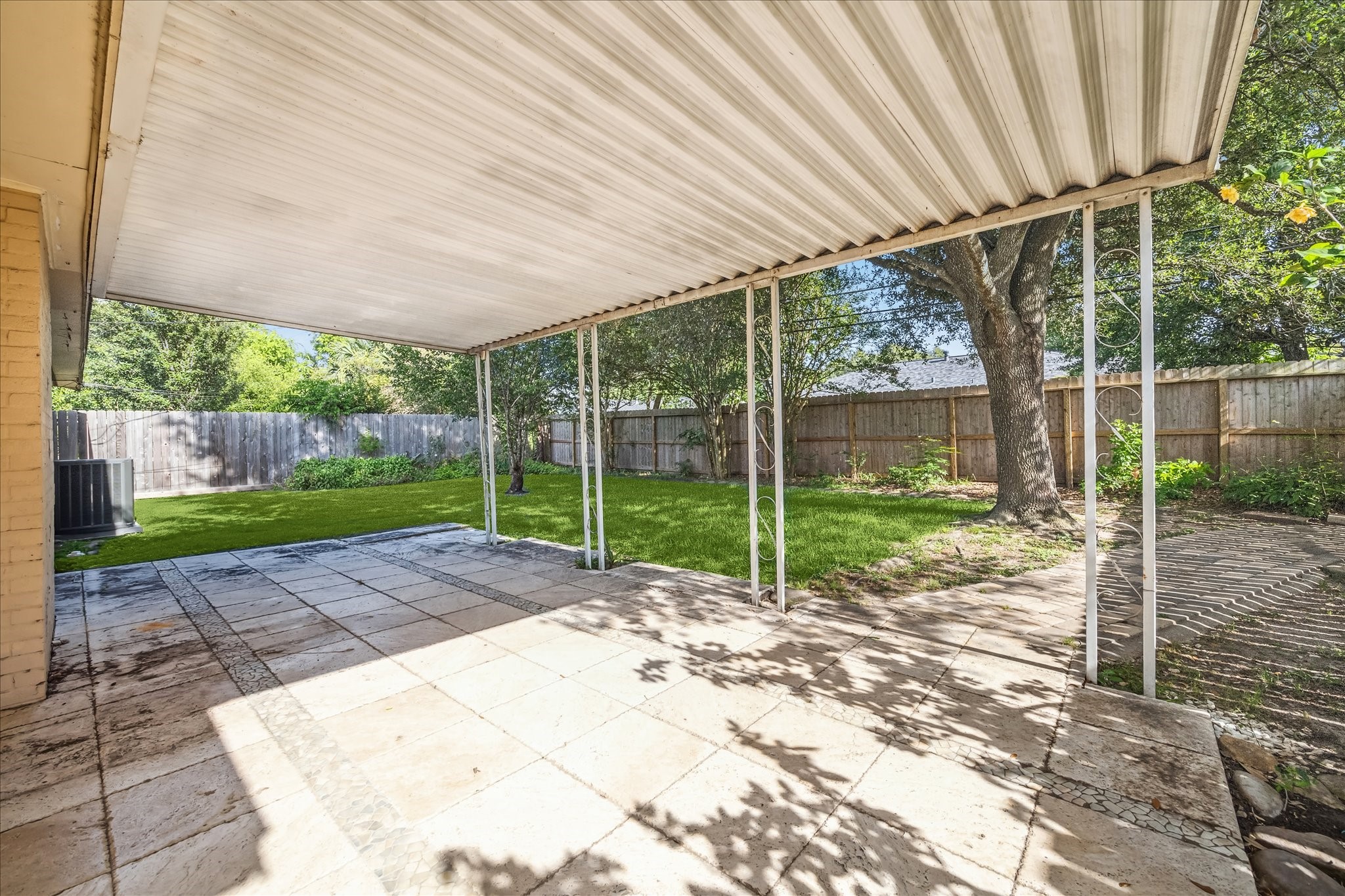 9407 Meadowbriar Lane Houston, TX 77063 - Photo 30 of 31 a view of a backyard with a bird door