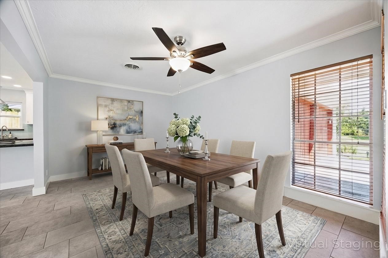 9407 Meadowbriar Lane Houston, TX 77063 - Photo 4 of 31 a dining room with furniture and window