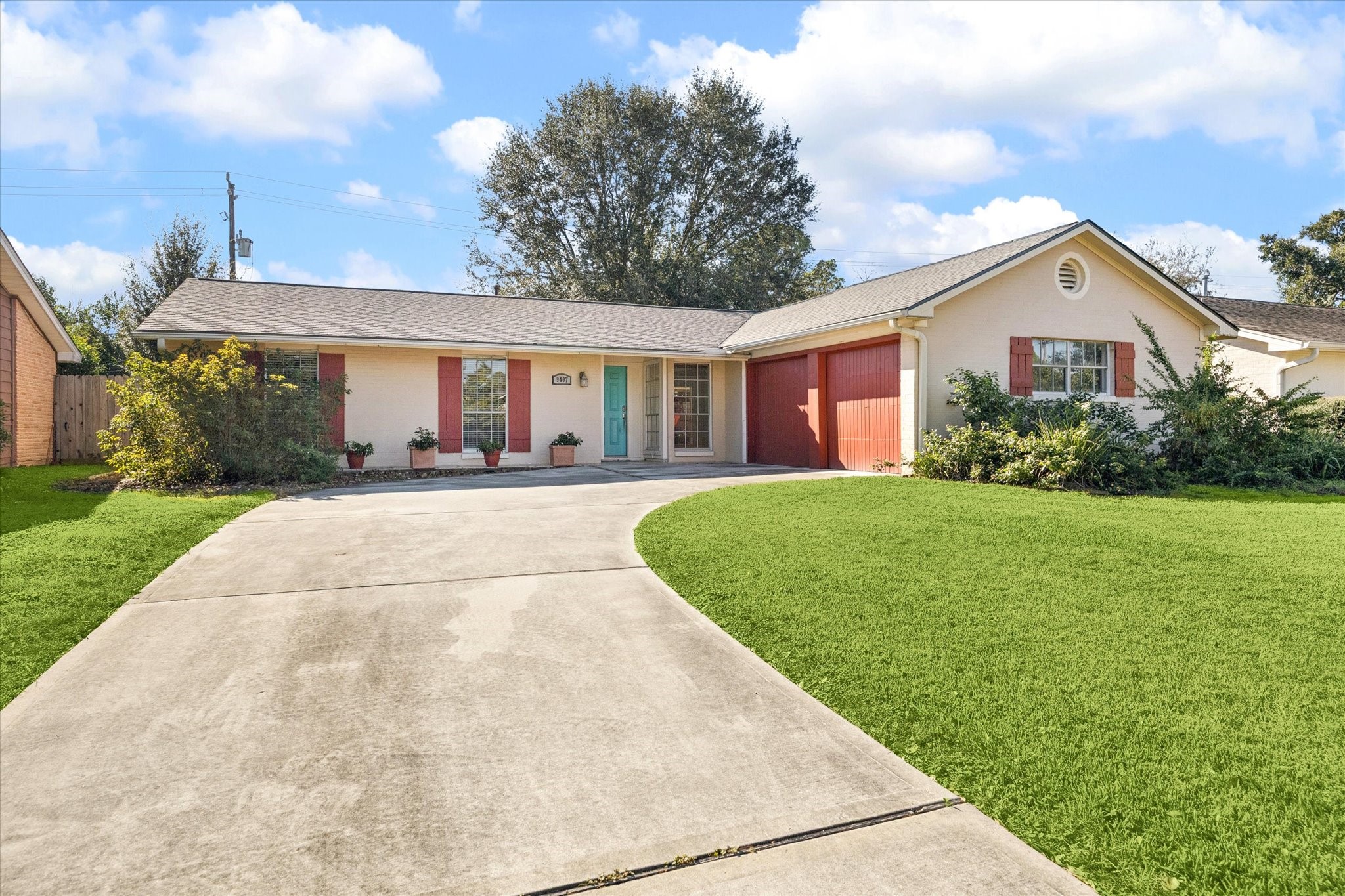 9407 Meadowbriar Lane Houston, TX 77063 - Photo 8 of 31 a front view of a house with a yard and potted plants