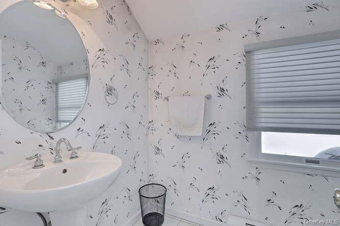 89 Spook Rock Road Suffern, NY 10901 - Photo 28 of 44 a bathroom with a bathtub and sink