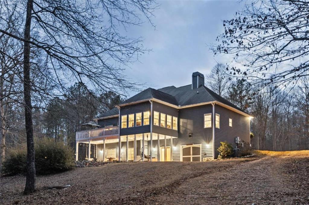 8399 East Carroll Road Whitesburg, GA 30185 - Photo 1 of 52 a front view of a house