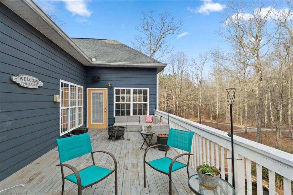 8399 East Carroll Road Whitesburg, GA 30185 - Photo 13 of 52 a view of a chairs with a table in the patio
