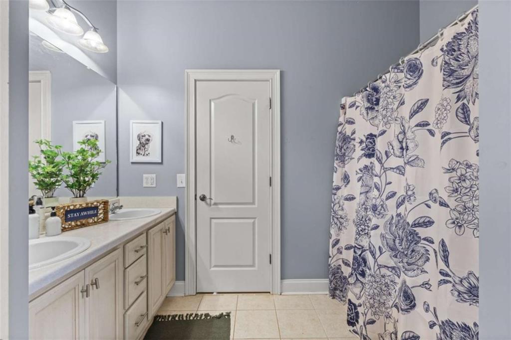 8399 East Carroll Road Whitesburg, GA 30185 - Photo 19 of 52 a bathroom with a sink and a mirror